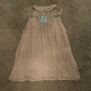 Hayden
Sleeveless light pink top with Lace Detail
NWT
Size Medium
